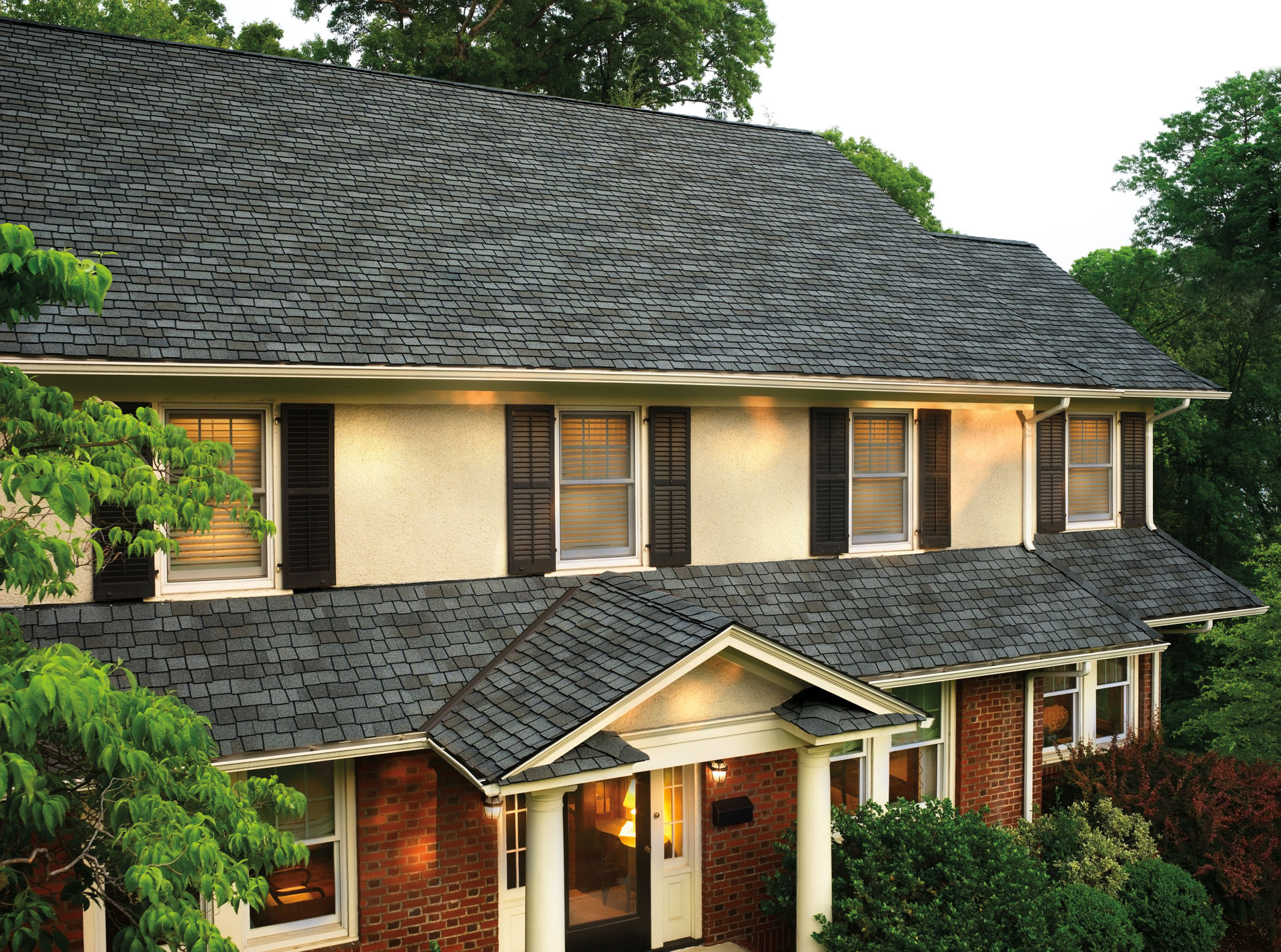 A beautiful, modern asphalt shingle roof on a large two story home.