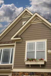 Close view of a home's grey siding